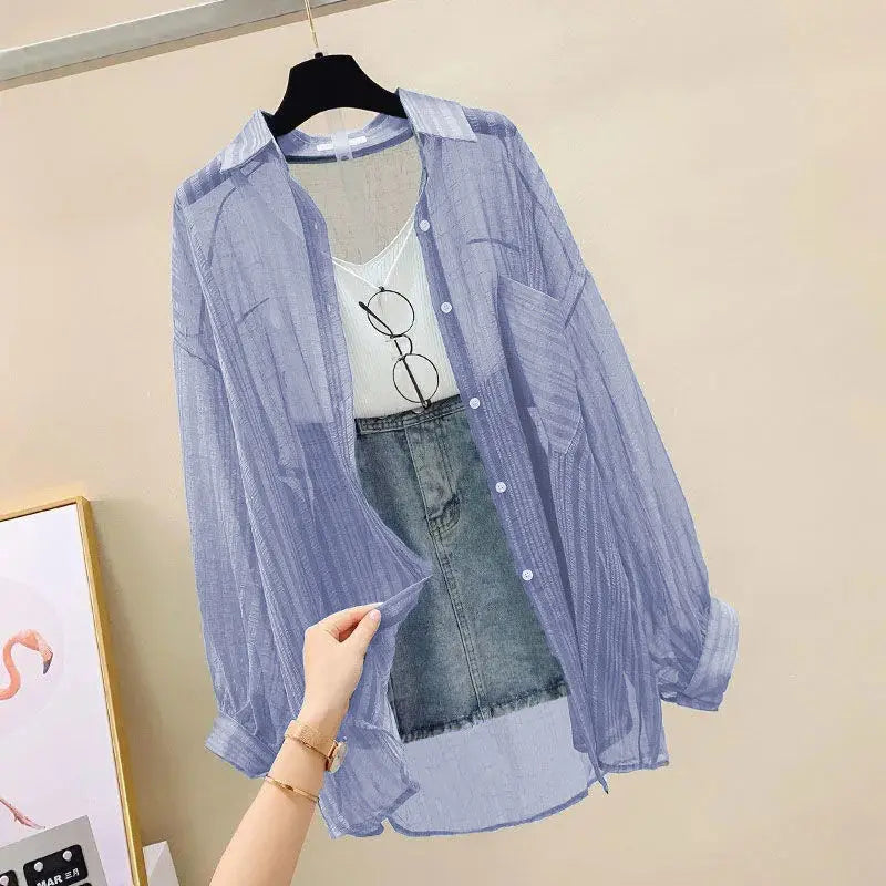 SunVeil™ sheer chiffon cardigan in light blue, styled over a tank top and denim skirt, perfect for casual spring/summer wear.