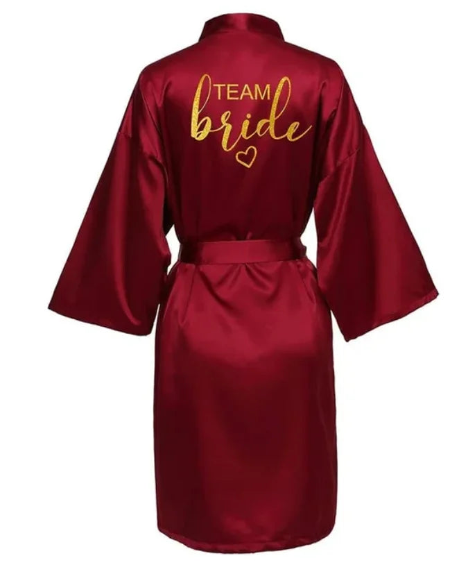 Team Bride gold letter satin kimono robe in burgundy for brides and bridal parties.
