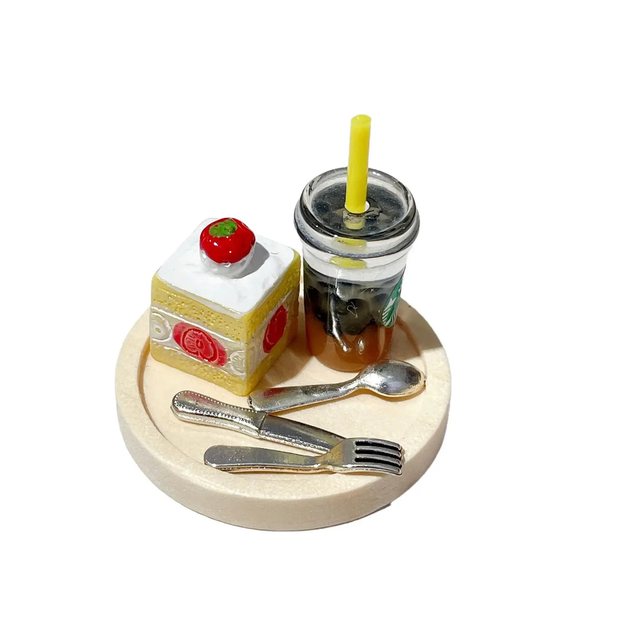 Miniature food set featuring a cake slice and a drink on a plate, ideal for dollhouse or photography props.