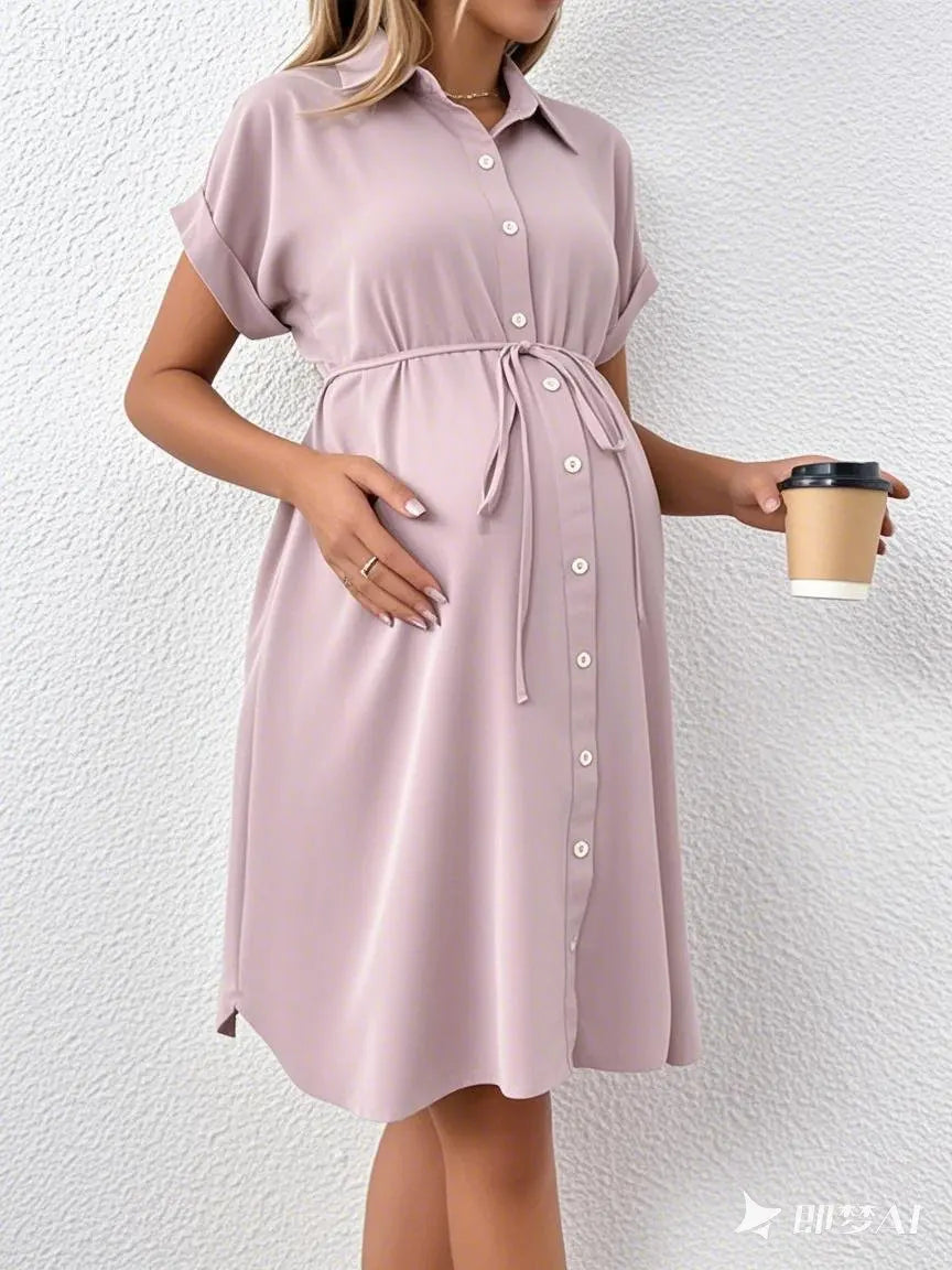 Styled striped button shirt maternity dress in soft pink, perfect for casual summer outings, designed for expectant mothers.