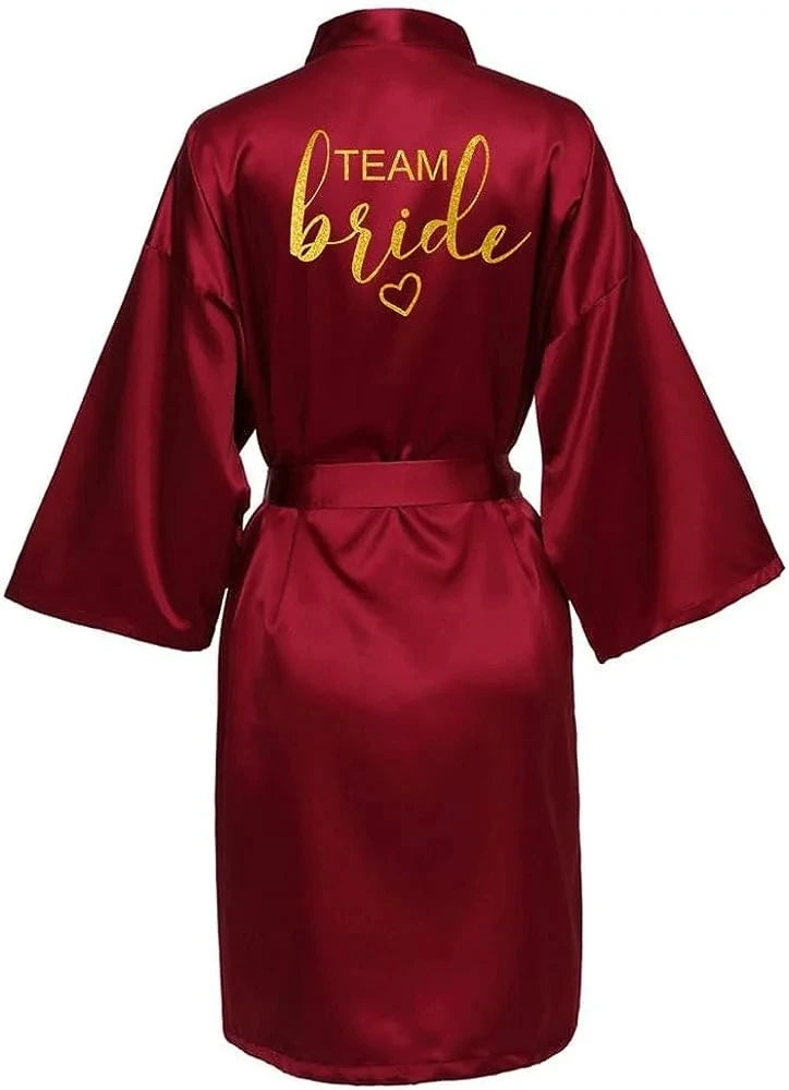Team Bride gold letter satin kimono robe in burgundy color, perfect for bridal party or wedding celebrations.