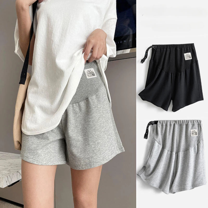 Plus size adjustable maternity shorts in gray and black, perfect for summer comfort with a loose fit for expectant mothers.