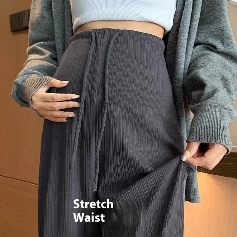 Close-up of wide-leg maternity pants with stretch waist feature, ideal for comfort during pregnancy.