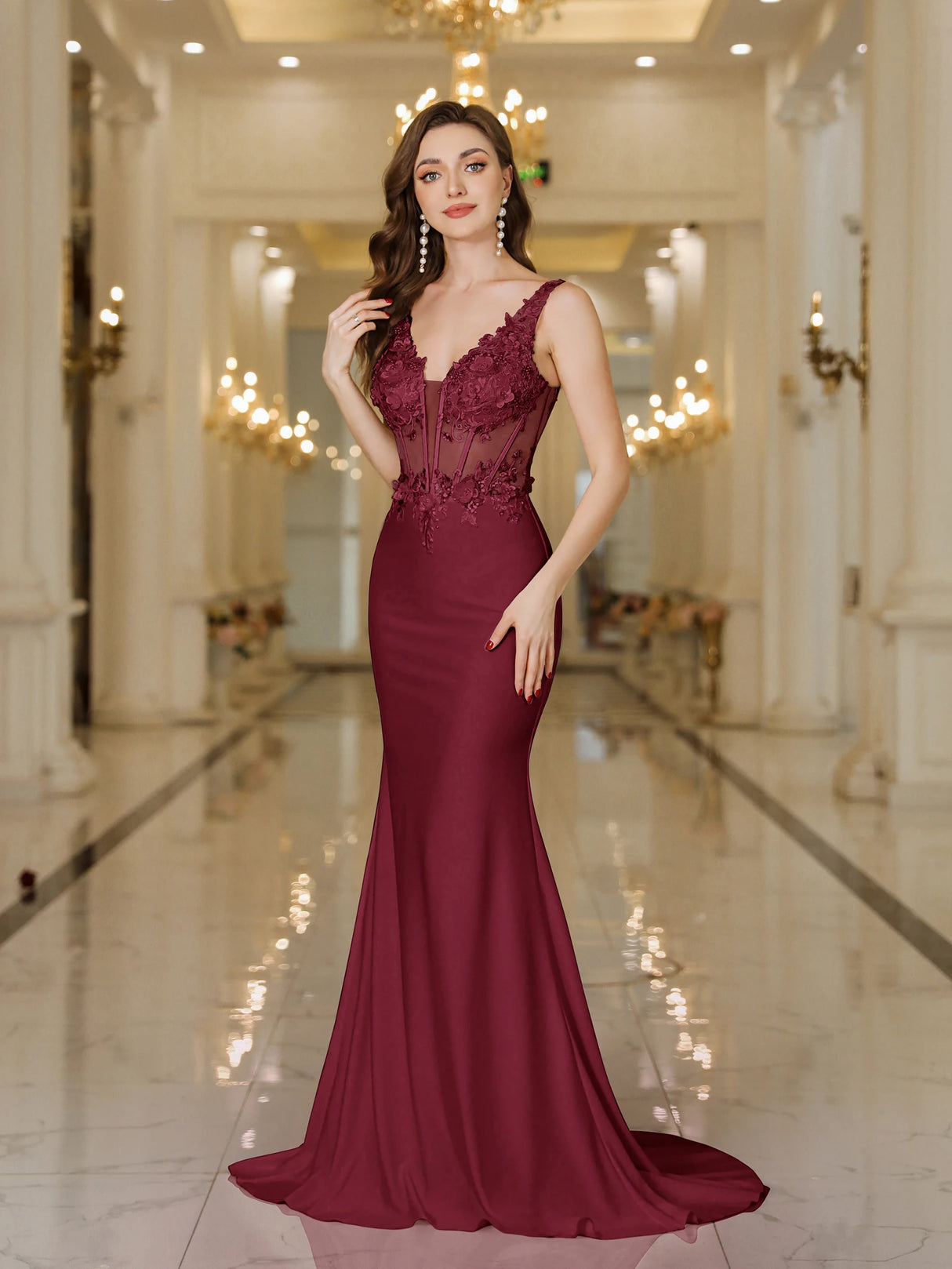 Elegant burgundy gown with lace details, fitted silhouette, and mermaid design, perfect for formal events.