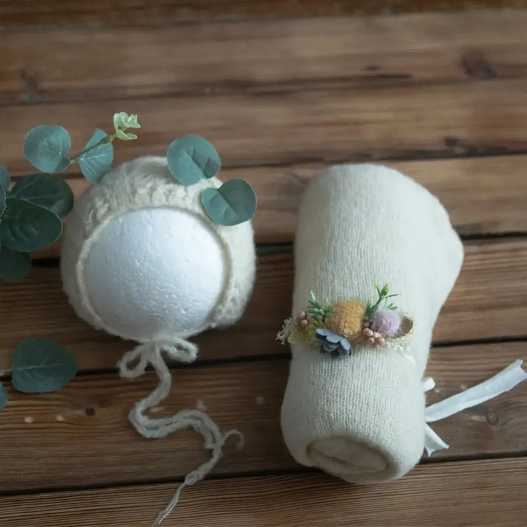 Newborn stretch knit mohair bonnet and wrap on wood background, perfect for baby photography props.