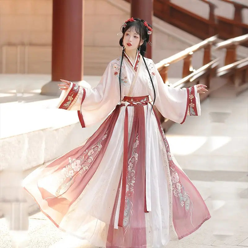 Elegant Hanfu traditional dress for women, perfect party outfit, featuring floral designs and flowing fabric.