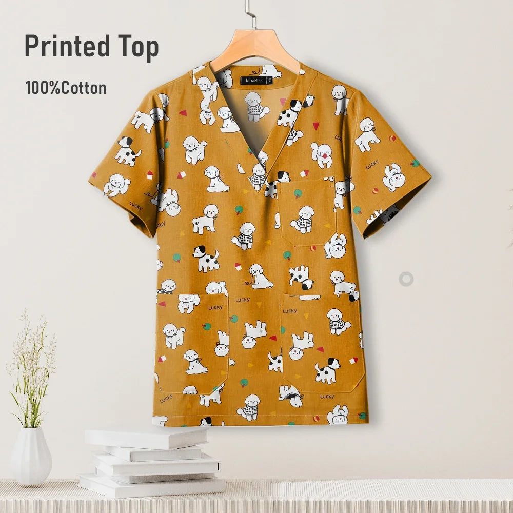 Cute printed V-neck hospital scrub top for women, 100% cotton, featuring fun puppy designs, ideal for pediatric nursing.