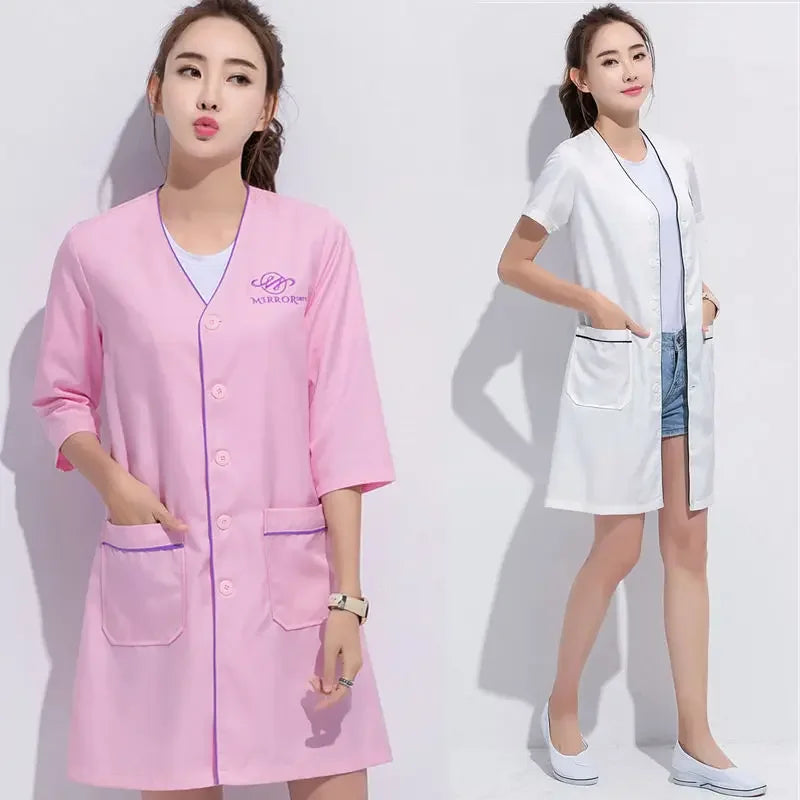 Custom logo spa beauty uniform featuring pink and white short sleeve lab coats for women, ideal for medical and salon use.