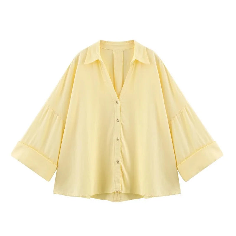 WideLine™ oversized yellow shirt with turn-down collar and button closure, perfect for summer casual wear.