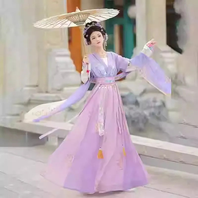 Elegant woman in a Hanfu traditional dress holding a parasol, showcasing a beautiful party outfit in a classic setting.