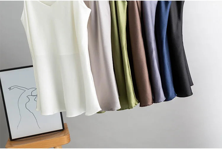 BandeauSilk™ double-layer silk camisoles in various colors displayed on hangers, perfect for summer wear.