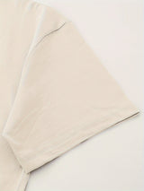 Close-up of the sleeve of a Retro Country Music Festival T-Shirt, showcasing the crew neck and cotton fabric.