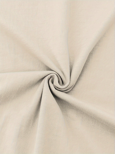 Close-up of soft beige cotton fabric, showcasing smooth texture and micro elasticity, ideal for casual clothing.