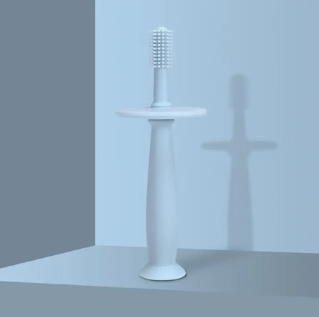 Soft silicone training toothbrush for babies, age range 0-6 years, designed for gentle oral care and comfort.