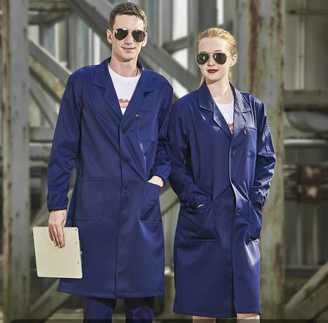Two individuals in matching navy blue workshop coveralls and sunglasses, showcasing durable work attire for utility and safety.