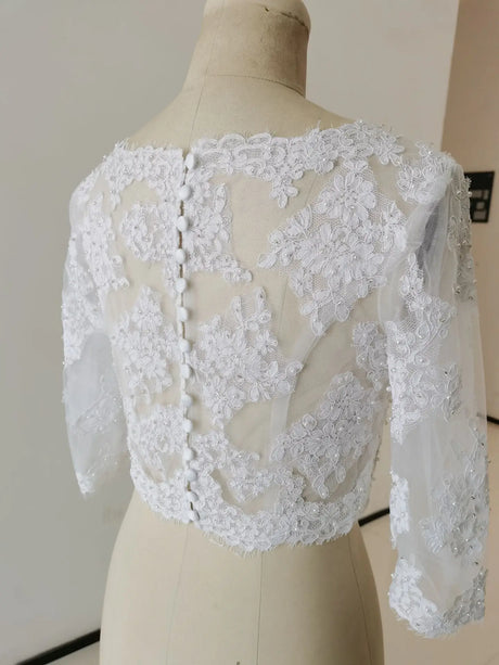 Elegant white Crystal Lace Wedding Bolero, 3/4 sleeve bridal wrap with intricate appliqued detailing.