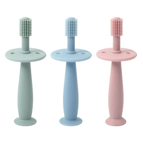Set of 3 soft silicone baby toothbrushes in green, blue, and pink for infants and toddlers training teeth.