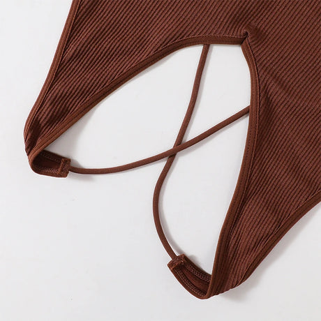 Detail of the MonoSculpt™ one-shoulder seamless crop top, showcasing ribbed texture and stylish strap design.