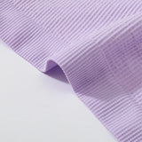 Close-up of the ribbed fabric in soft lavender color for the DeepVibe™ seamless crop top.