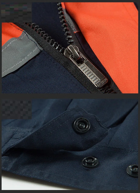 Close-up of zipper and snap buttons on breathable short-sleeve coveralls for men and women in navy and orange.