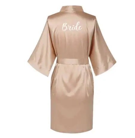 Rose gold satin bride robe for women, showcasing elegant back design with 'Bride' embroidery.