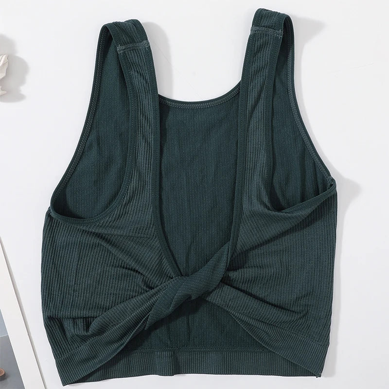 DeepVibe™ deep V ribbed crop top in dark green, seamless design perfect for streetwear and casual styling.