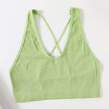 MonoSculpt™ green seamless crop top with crisscross back for women, perfect for streetwear-inspired outfits.