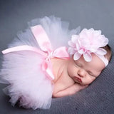 Newborn girl in pink tutu skirt and matching headband, perfect for baby photography and special occasions.