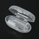 Transparent toothbrush case with a cleaning brush inside, ideal for travel and hygiene.