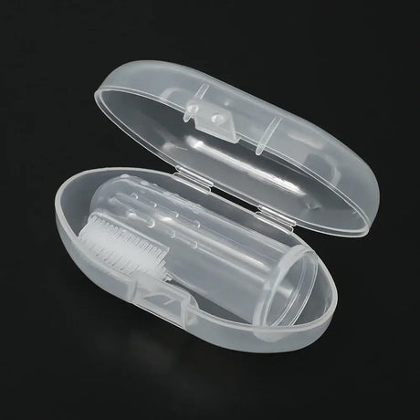 Transparent toothbrush case with a cleaning brush inside, ideal for travel and hygiene.