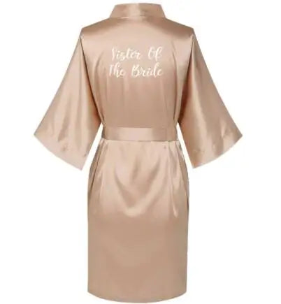 Rose gold satin robe with "Sister of the Bride" embroidered, perfect for bridal parties and weddings.