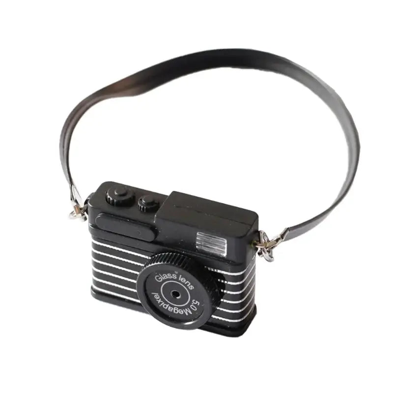 Mini camera for dollhouses, 1/12 scale, black design, perfect baby photography prop, suitable for ages 0-12 months.