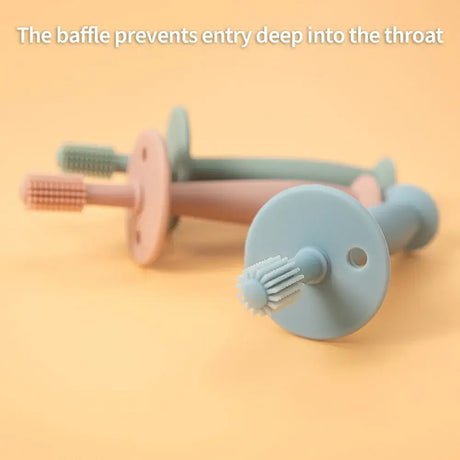 Baby soft silicone toothbrushes with baffle design to prevent deep throat entry, suitable for infants and toddlers.