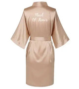 Rose gold satin silk maid of honor robe with short sleeves and elegant lettering on the back.