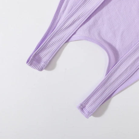 Close-up of the ribbed straps of a lavender seamless crop top, highlighting its soft knit material and design.