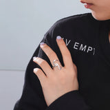 Close-up of a woman wearing a stylish silver ring, showcasing modern fashion jewelry and daily wear elegance.