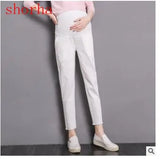 Casual 3-color maternity pants in white, featuring pockets and a comfortable fit, ideal for all seasons.