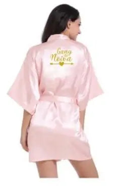 Light pink satin bridesmaid robe with elegant "Gangsta Nova" print on the back, perfect for summer weddings.