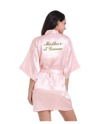Light pink satin robe for mothers of the groom, featuring elegant 'Mother of the Groom' embroidery on the back.