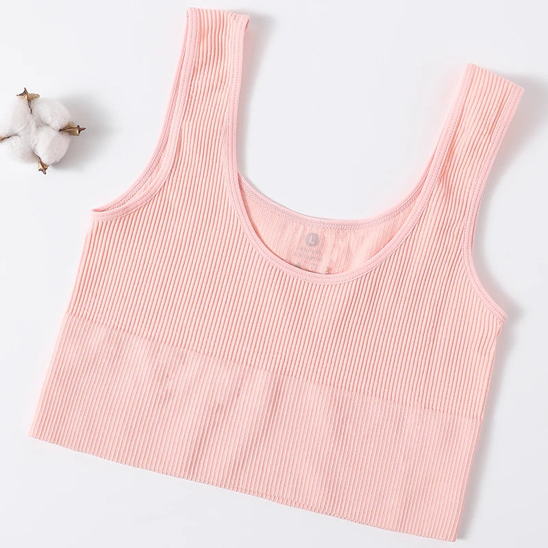 Pink seamless ribbed camisole, women's fitness-ready tank top, soft nylon-spandex blend, perfect for summer wear.