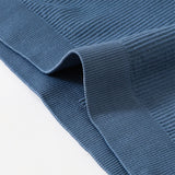 Close-up of ribbed blue fabric showcasing the seamless knit texture, perfect for stylish activewear.