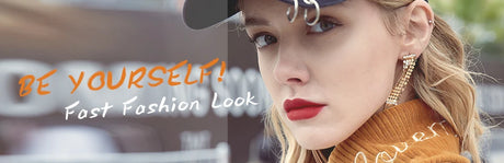 Stylish woman with bold lipstick and earrings, showcasing fast fashion trend in urban setting.