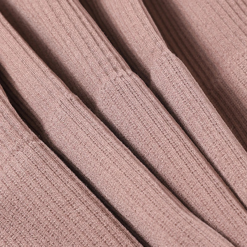 Close-up of ribbed fabric texture in a soft pink color, ideal for seamless camisoles and tank tops.