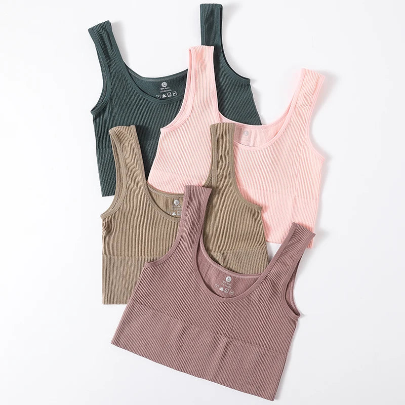 Set of RibSculpt seamless ribbed camisoles in green, pink, brown, and beige, ideal for fitness and summer layering.