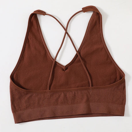 MonoSculpt One-Shoulder Seamless Crop Top in brown, featuring a stylish crisscross back design.