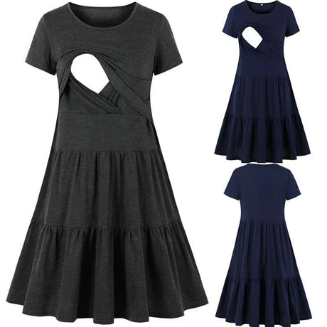 Sleeveless pleated nursing dress in grey and navy, featuring a stylish cutout and knee-length design, perfect for maternity wear.