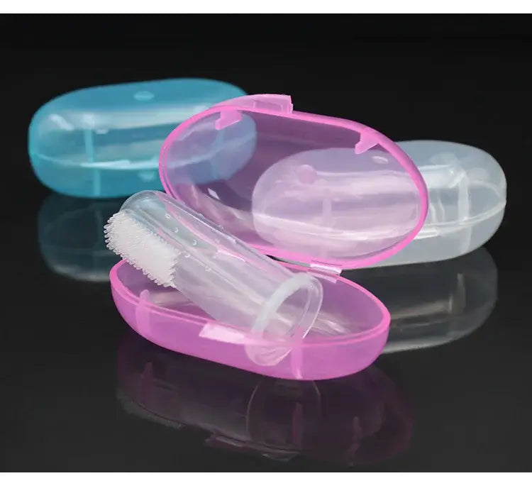 Colorful baby toothbrush cases in pink and blue with transparent containers for easy storage and hygiene.