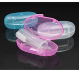 Colorful baby toothbrush cases in pink and blue with transparent containers for easy storage and hygiene.