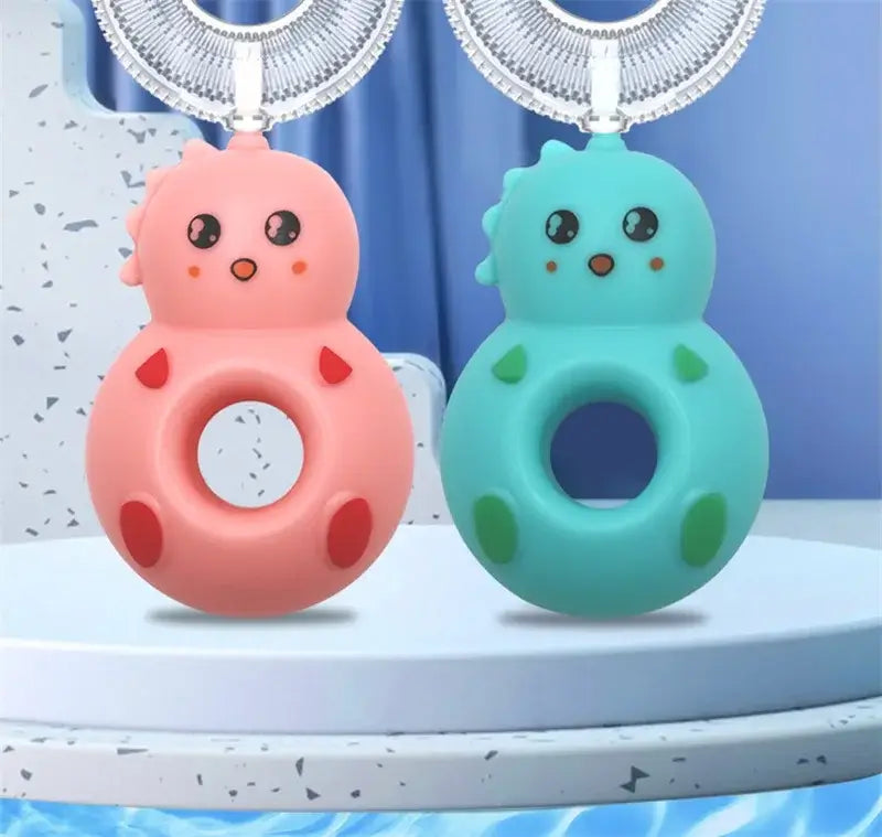 Cute silicone baby toothbrushes in pink and blue, designed for training little ones. Ideal for ages 0-6 years.