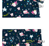 Cartoon print scrub tops with fun dental and star patterns, suitable for medical professionals, available in various sizes.
